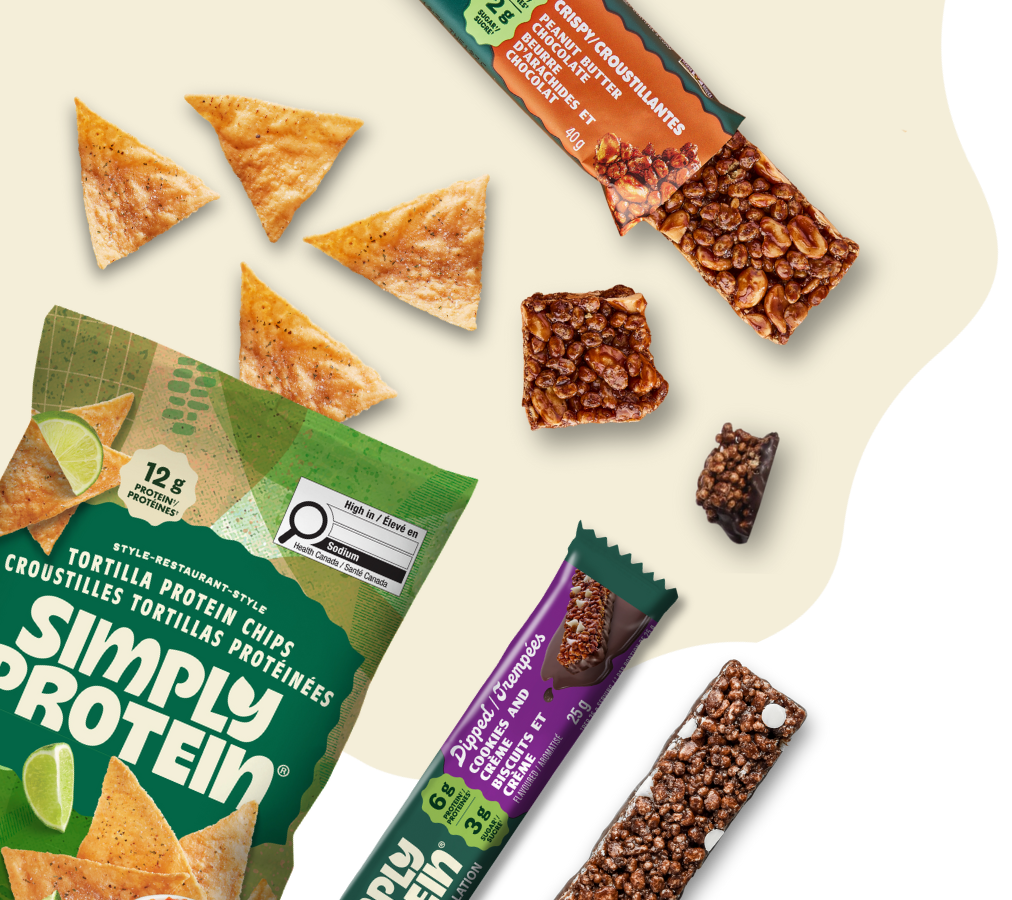Assorted protein snacks including tortilla chips and bars on a beige background